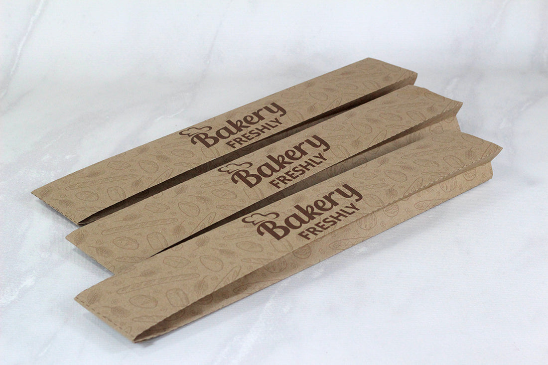 Millar de Empaques para Pan Baguette Kraft o Bond Personalizadas Medidas: 9x55x5 cm.
