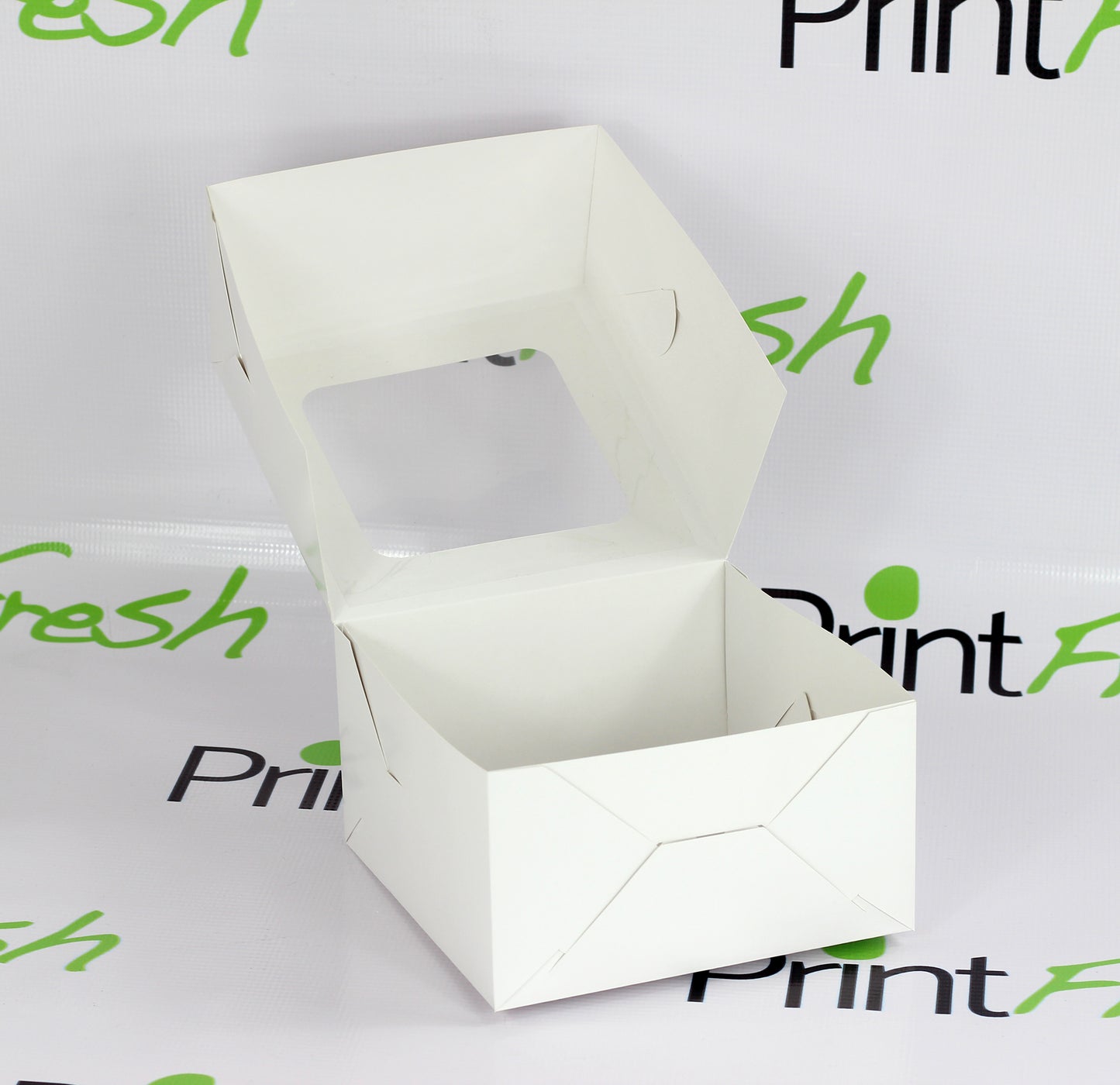 Ciento de Cajas Cuadradas con Ventana de Acetato. Medidas: 19.5x19.5x11 CM.